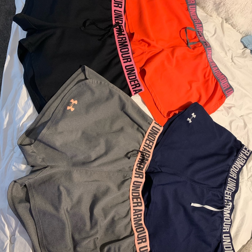 4 pairs of size large under armour athletic shorts, all 4 pairs come w/ purchase